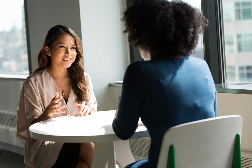 A person reviewing their life insurance policy with an insurance agent
